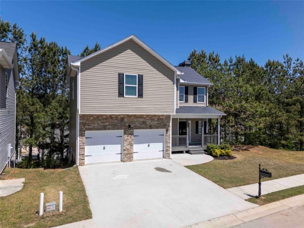68 Crescent Commons Drive Dallas, GA 30157 - Photo 2 of 26 a front view of a house with entertaining space