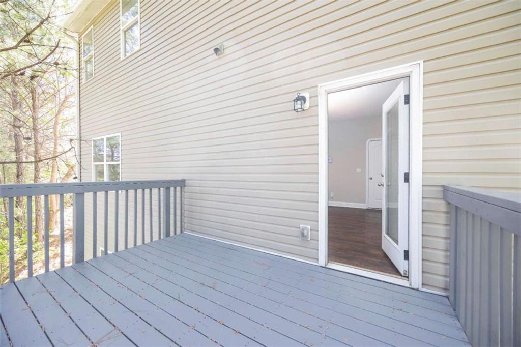 68 Crescent Commons Drive Dallas, GA 30157 - Photo 22 of 26 an empty room with wooden floor and windows