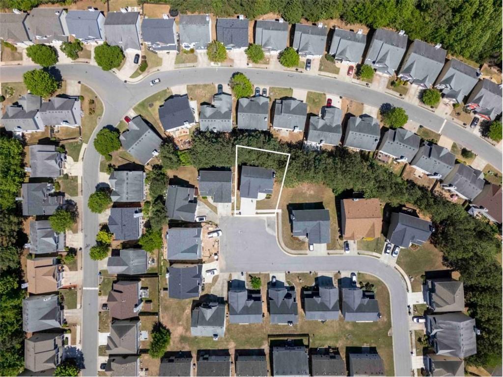 68 Crescent Commons Drive Dallas, GA 30157 - Photo 26 of 26 a picture of building with yard and outdoor seating