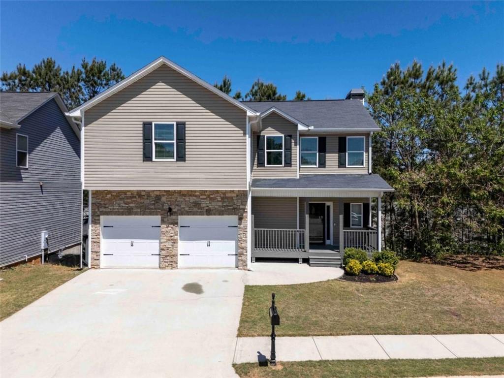 68 Crescent Commons Drive Dallas, GA 30157 - Photo 3 of 26 a view of house with yard outdoor seating and entertaining space