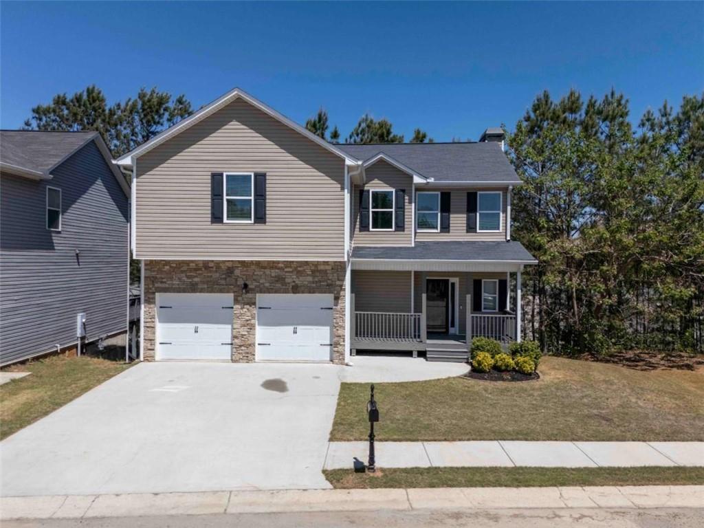 68 Crescent Commons Drive Dallas, GA 30157 - Photo 4 of 26 a front view of a house with garden