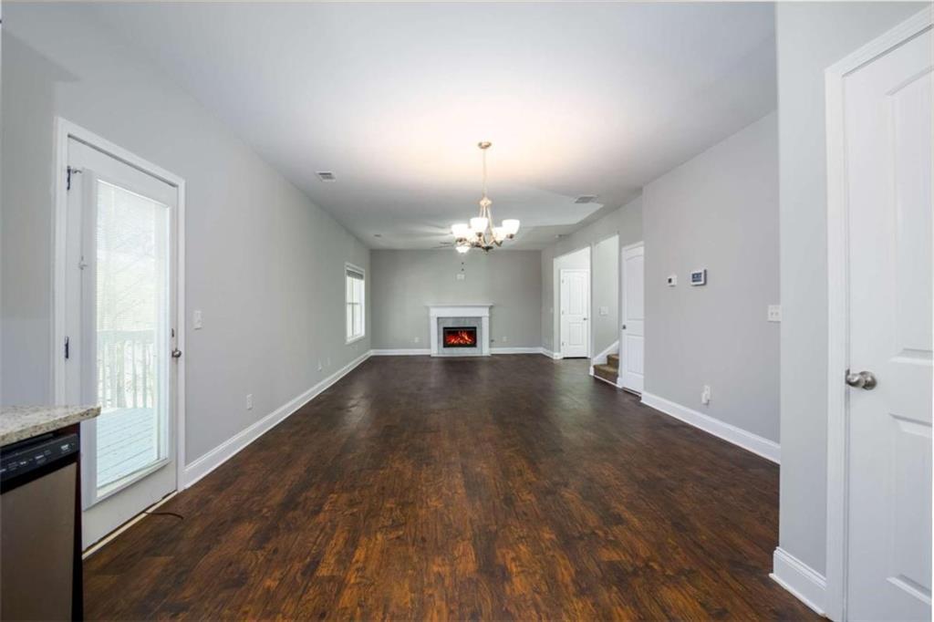 68 Crescent Commons Drive Dallas, GA 30157 - Photo 6 of 26 a view of a livingroom with wooden floor and a window