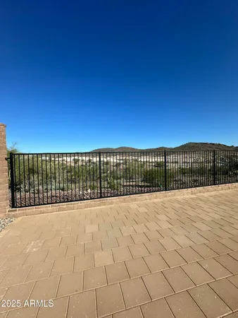 a view of roof with wooden fence