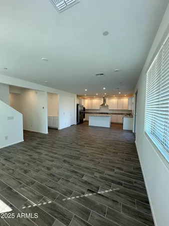 a view of kitchen and empty room
