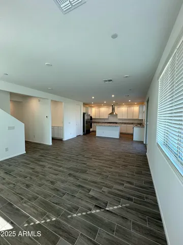 a view of kitchen and empty room