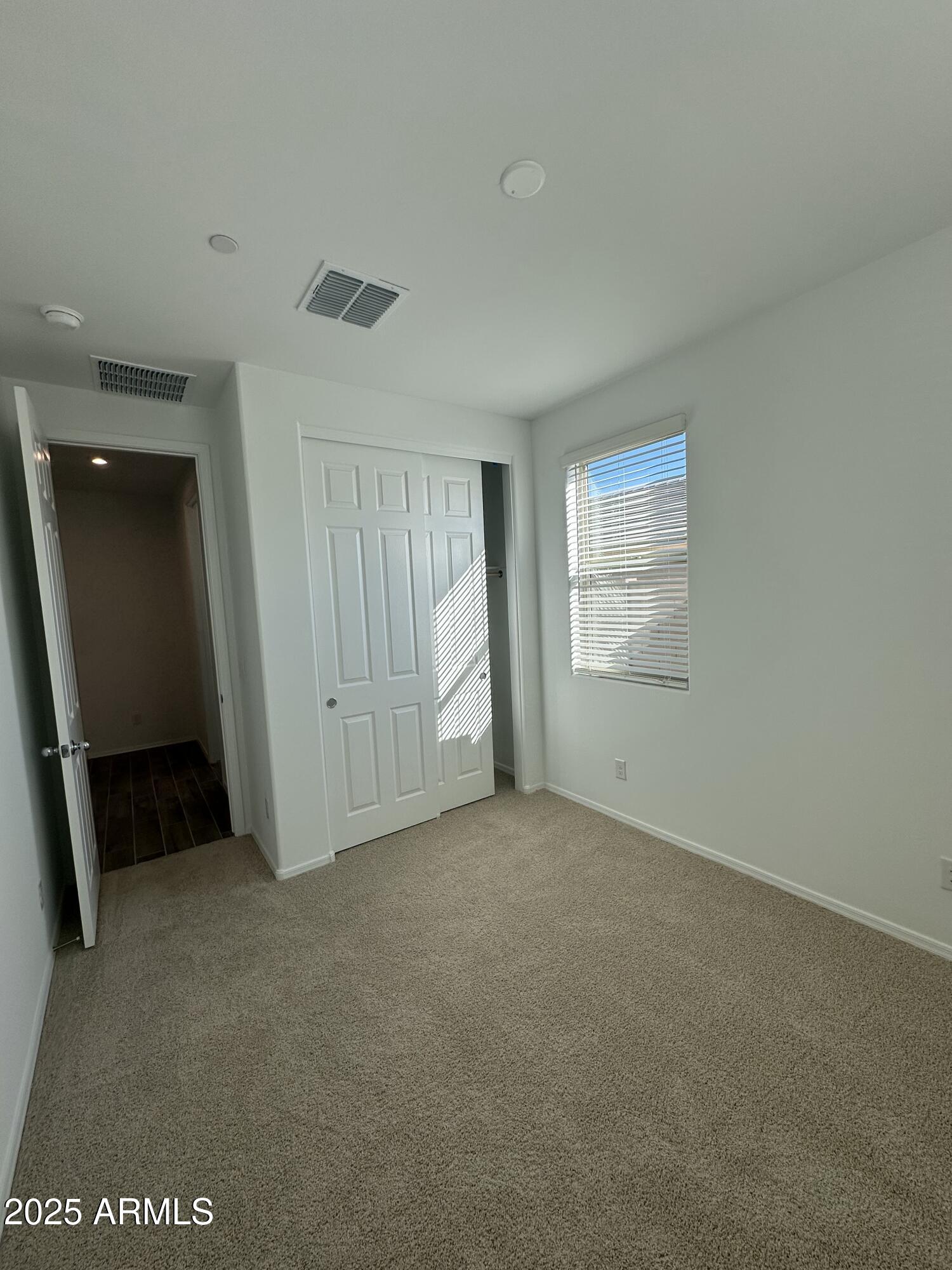 13330 West Eagle Feather Road Peoria, AZ 85383 - Photo 2 of 34 an empty room with windows