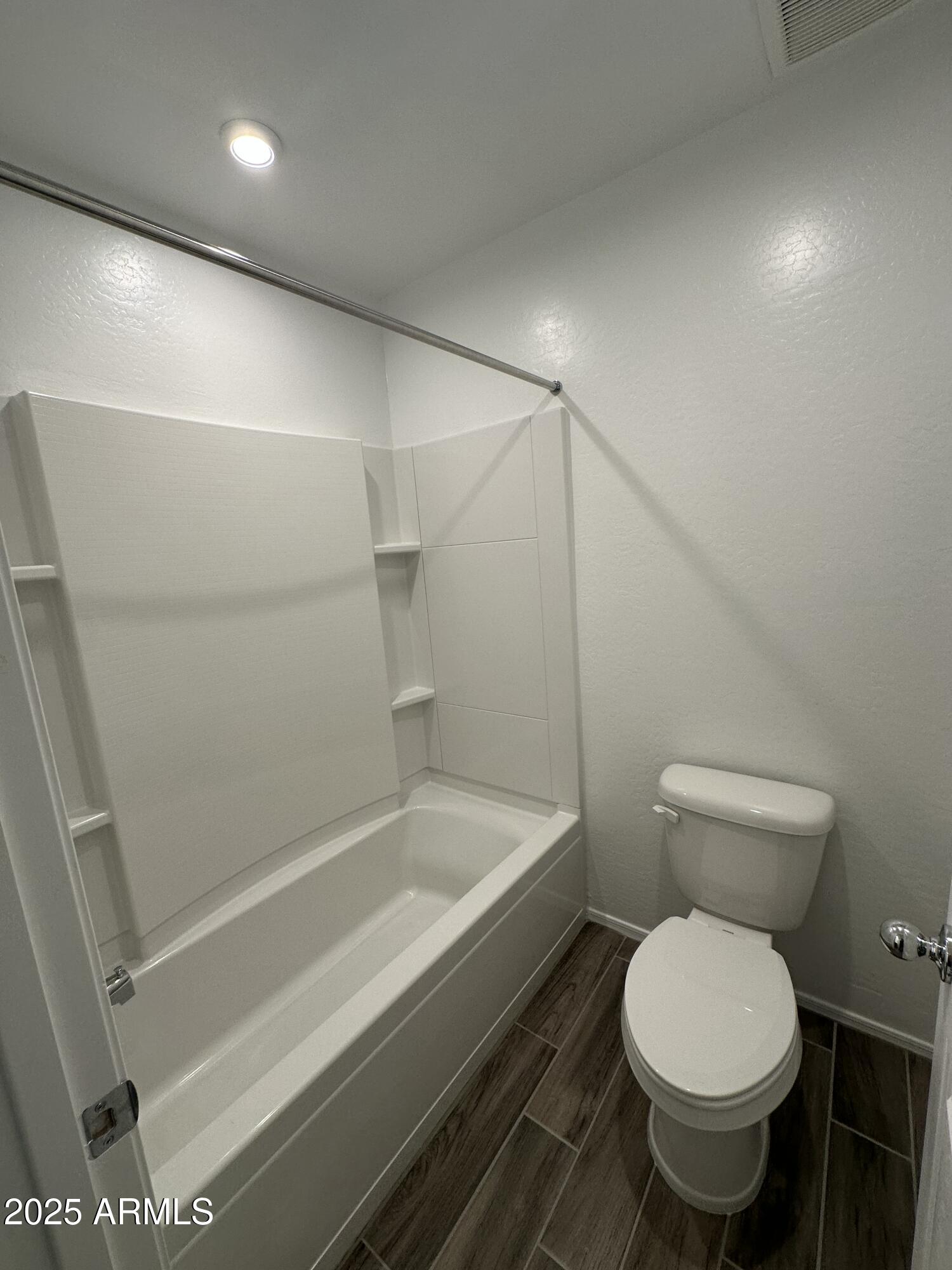 13330 West Eagle Feather Road Peoria, AZ 85383 - Photo 25 of 34 a bathroom with a toilet and a shower