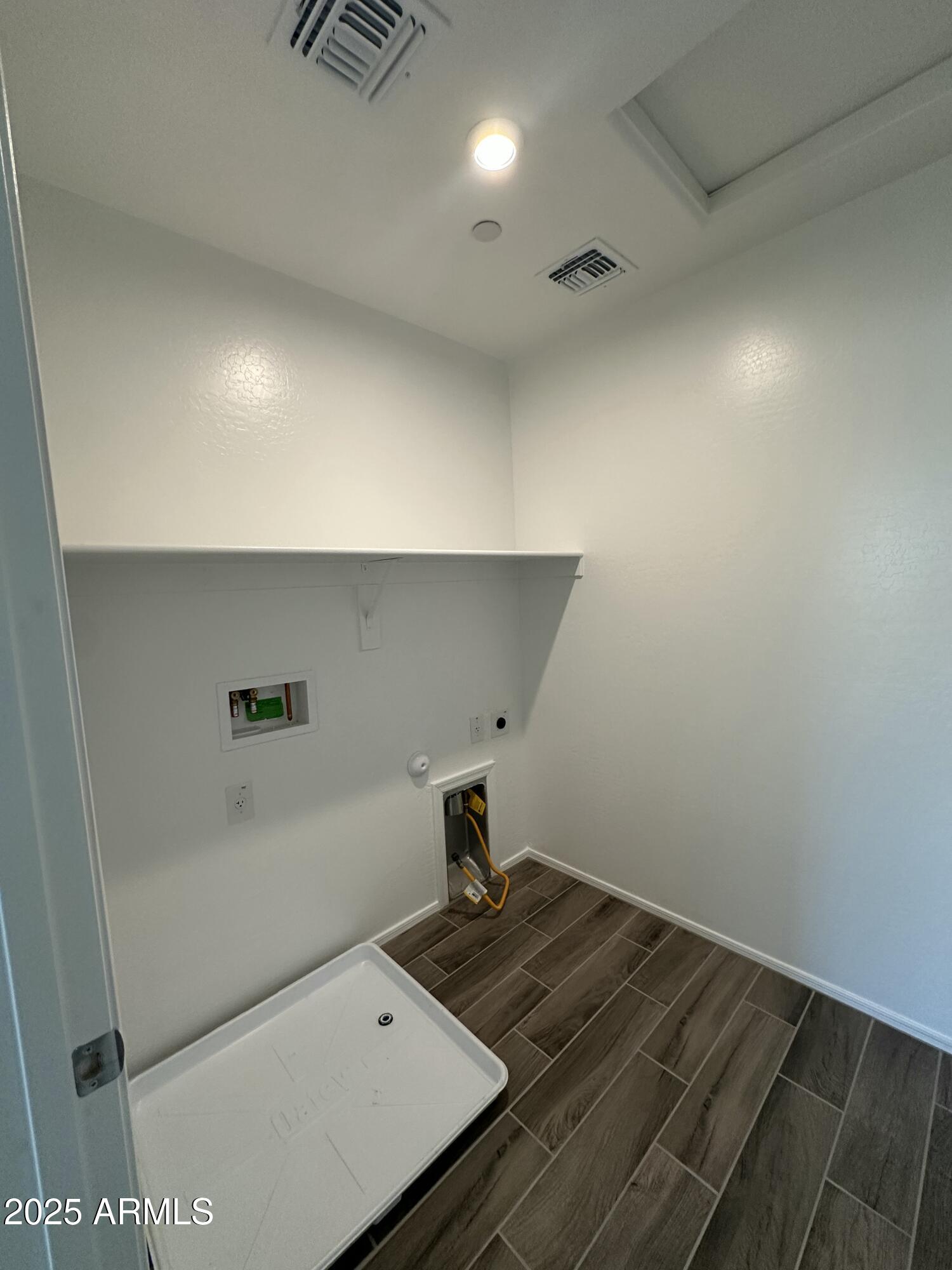 13330 West Eagle Feather Road Peoria, AZ 85383 - Photo 26 of 34 a bedroom with a bed and wooden floor