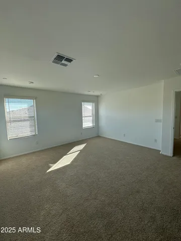 a view of empty room with windows