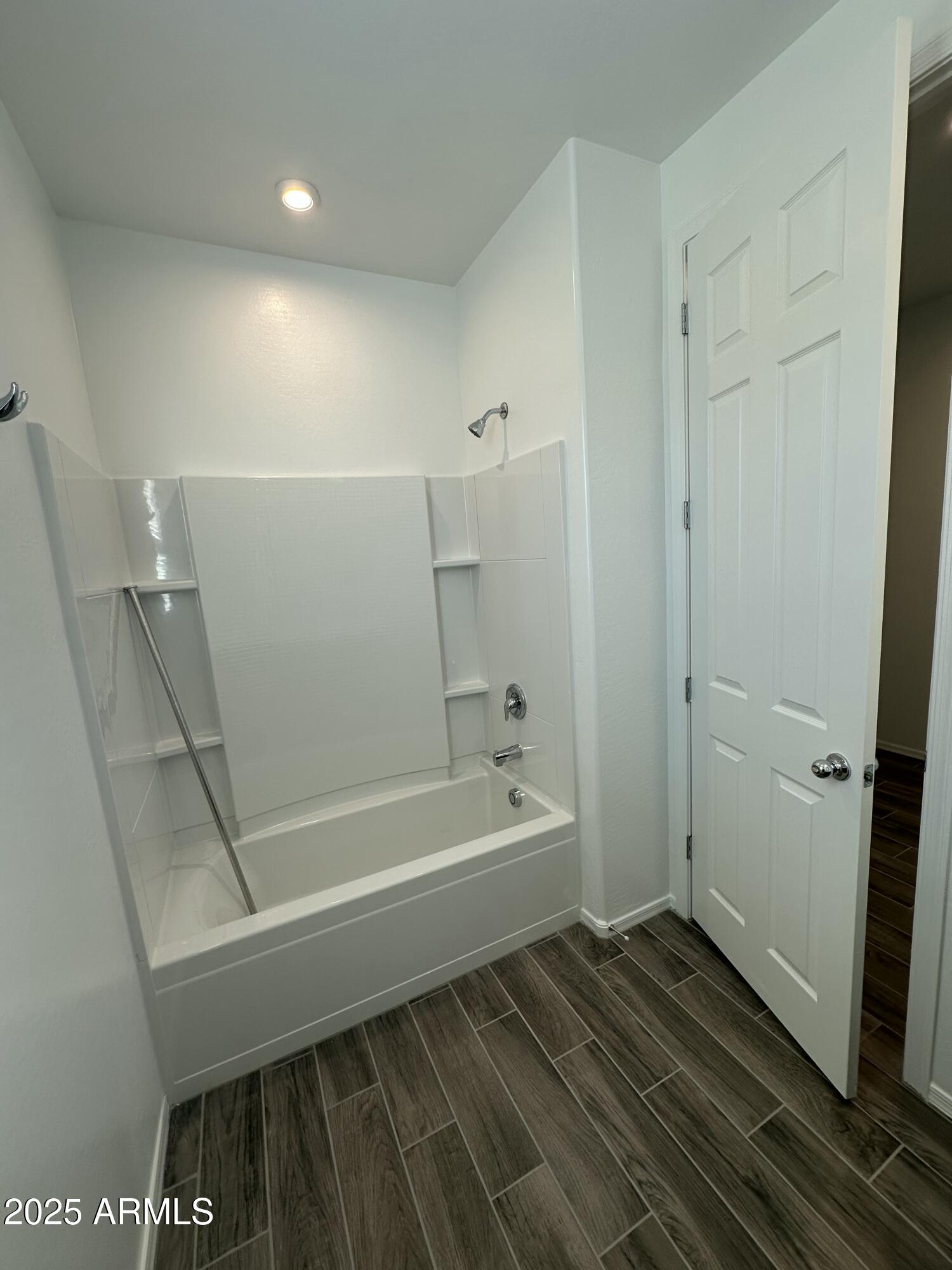 13330 West Eagle Feather Road Peoria, AZ 85383 - Photo 3 of 34 a bathroom with a bathtub and a shower