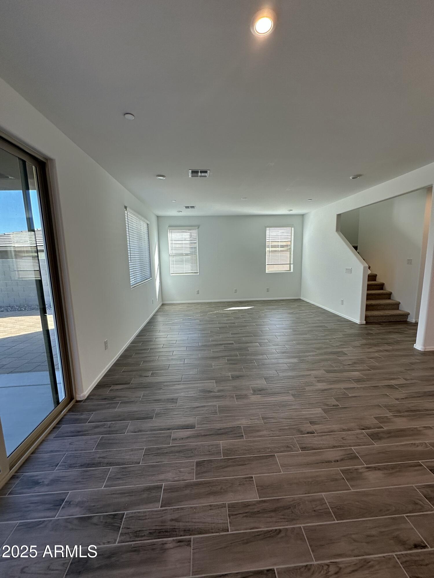 13330 West Eagle Feather Road Peoria, AZ 85383 - Photo 9 of 34 a view of empty room with wooden floor