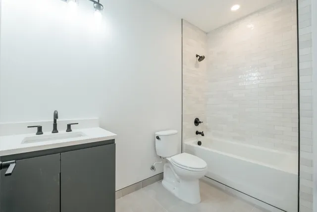 a bathroom with a toilet a sink and a bathtub