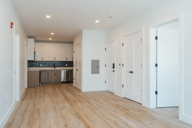 a view of kitchen with wooden floor
