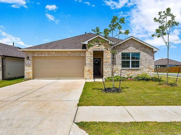 305 Evergreen Sumac Loop Kyle, TX 78640 - Photo 1 of 29 a front view of a house with a yard