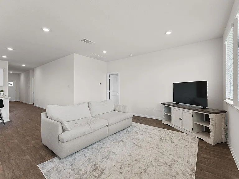 305 Evergreen Sumac Loop Kyle, TX 78640 - Photo 11 of 29 a living room with furniture and a flat screen tv