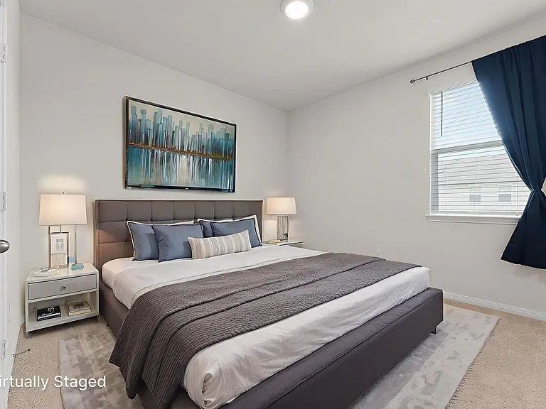 305 Evergreen Sumac Loop Kyle, TX 78640 - Photo 20 of 29 a bedroom with a bed and a window