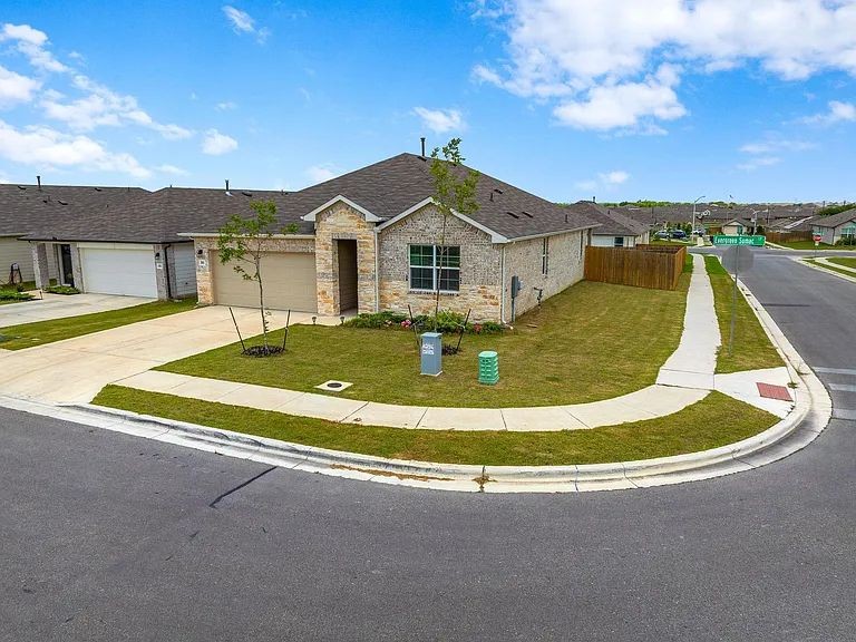 305 Evergreen Sumac Loop Kyle, TX 78640 - Photo 2 of 29 a view of a house with a swimming pool