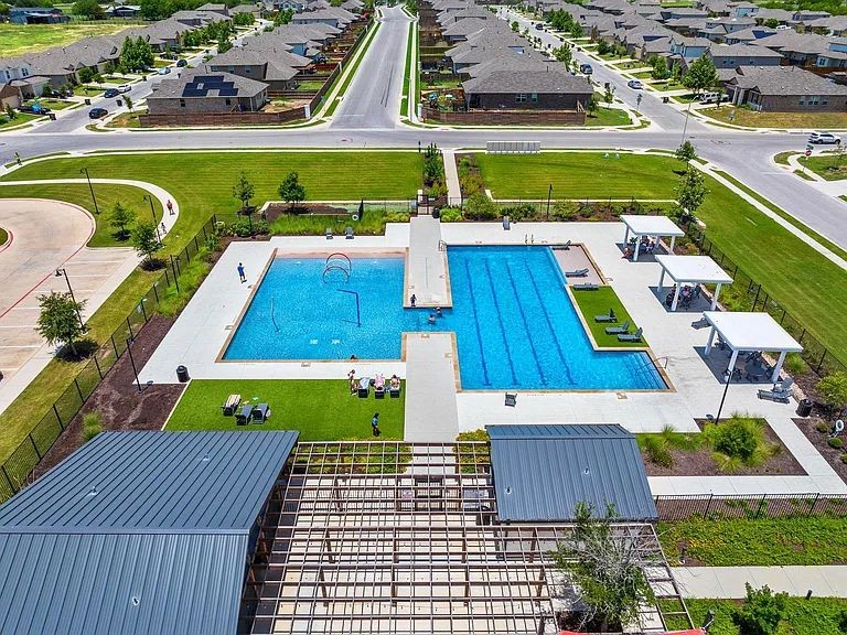 305 Evergreen Sumac Loop Kyle, TX 78640 - Photo 28 of 29 a view of swimming pool with outdoor seating