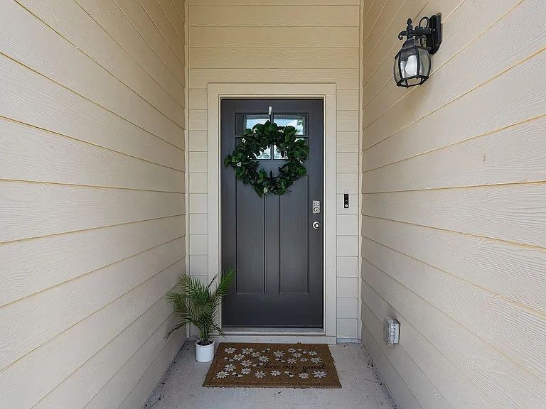 305 Evergreen Sumac Loop Kyle, TX 78640 - Photo 5 of 29 a view of entryway with wooden floor