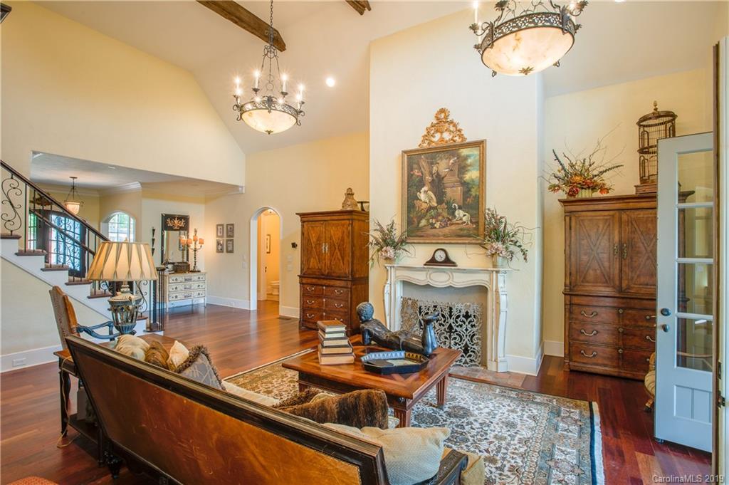 243 Trail Ridge Road Rutherfordton, NC 28139 - Photo 12 of 45 a dining room with furniture a chandelier and wooden floor
