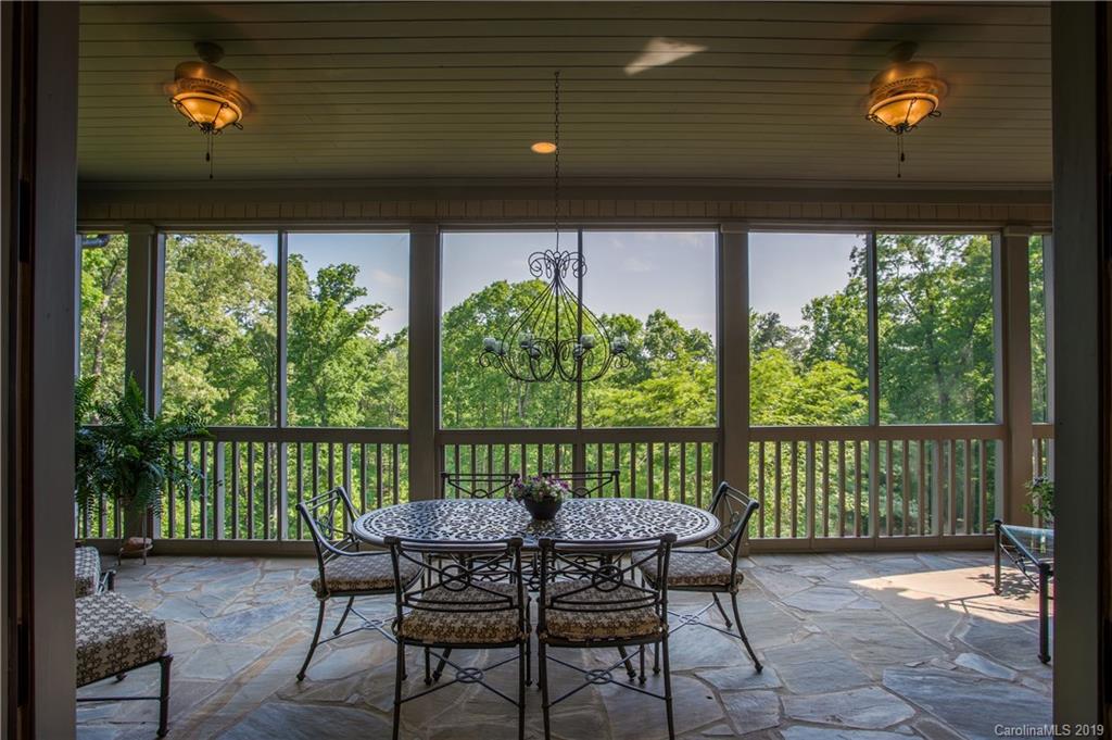 243 Trail Ridge Road Rutherfordton, NC 28139 - Photo 13 of 45 a view of a chairs and table in patio