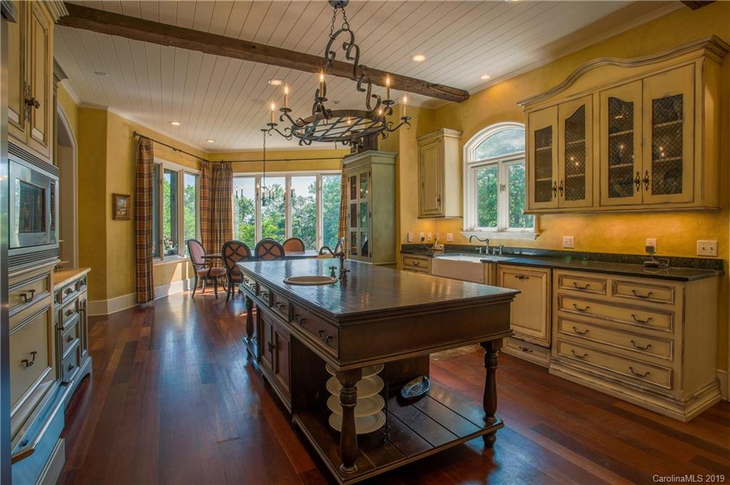 243 Trail Ridge Road Rutherfordton, NC 28139 - Photo 19 of 45 a dining hall with stainless steel appliances granite countertop a stove and a view of living room