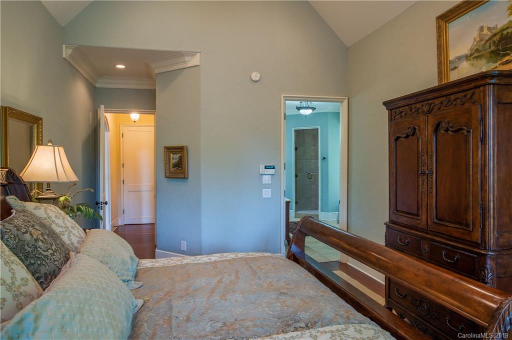 243 Trail Ridge Road Rutherfordton, NC 28139 - Photo 23 of 45 a bedroom with a bed and a mirror