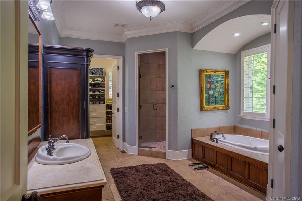 243 Trail Ridge Road Rutherfordton, NC 28139 - Photo 24 of 45 a bathroom with a tub sink and a mirror