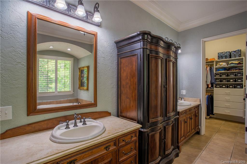 243 Trail Ridge Road Rutherfordton, NC 28139 - Photo 25 of 45 a bathroom with a sink a mirror and a shower