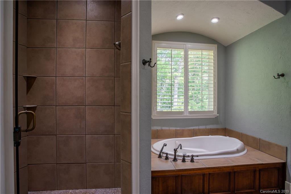 243 Trail Ridge Road Rutherfordton, NC 28139 - Photo 26 of 45 a bathroom with a bathtub and a window