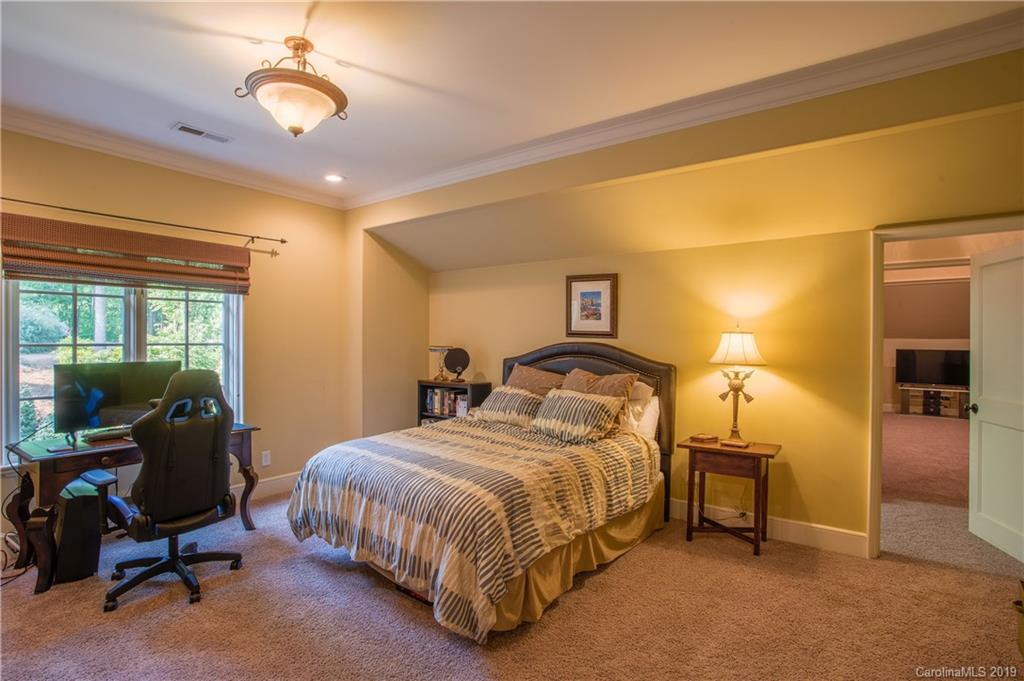 243 Trail Ridge Road Rutherfordton, NC 28139 - Photo 29 of 45 a bedroom with a bed a table and chairs