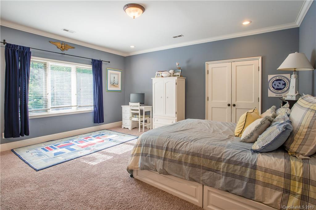 243 Trail Ridge Road Rutherfordton, NC 28139 - Photo 31 of 45 a bedroom with a bed and a lamp