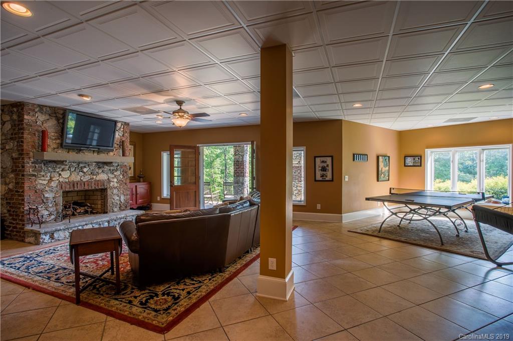 243 Trail Ridge Road Rutherfordton, NC 28139 - Photo 36 of 45 a living room with furniture a fireplace and a table