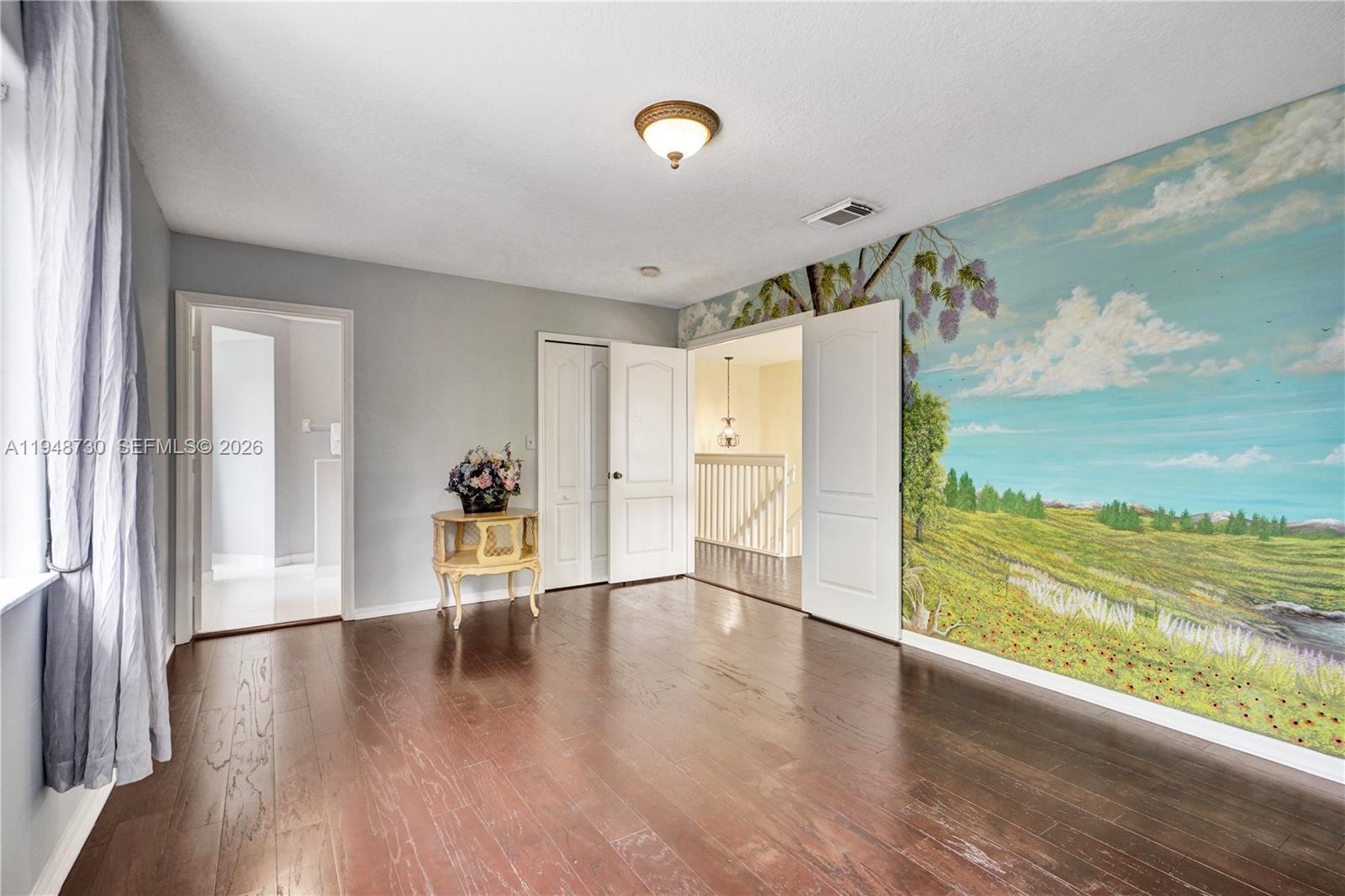 5502 Southwest 162nd Place Miami, FL 33185 - Photo 31 of 72 a view of an entryway with wooden floor