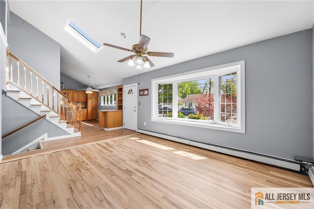 67 Drake Place Colonia, NJ 07067 - Photo 4 of 31 a view of an empty room with wooden floor and a window