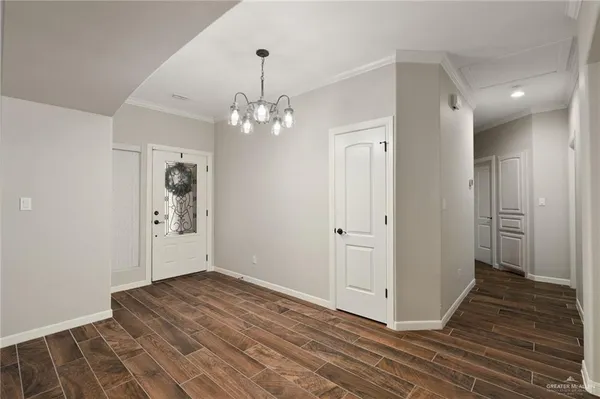 a view of a room with wooden floor and staircase