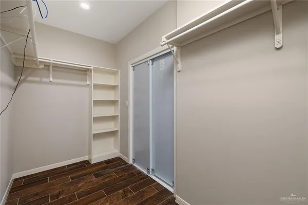 a view of an empty walk in closet