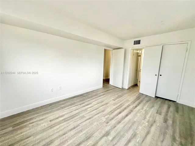 a bathroom with a toilet a sink a mirror and bathtub