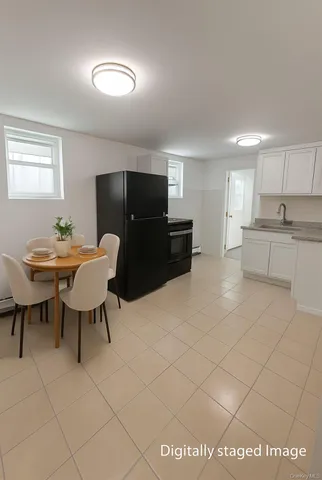 a living room with furniture a dining table and a piano table