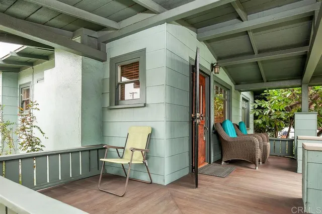 a view of a chair and table in the balcony