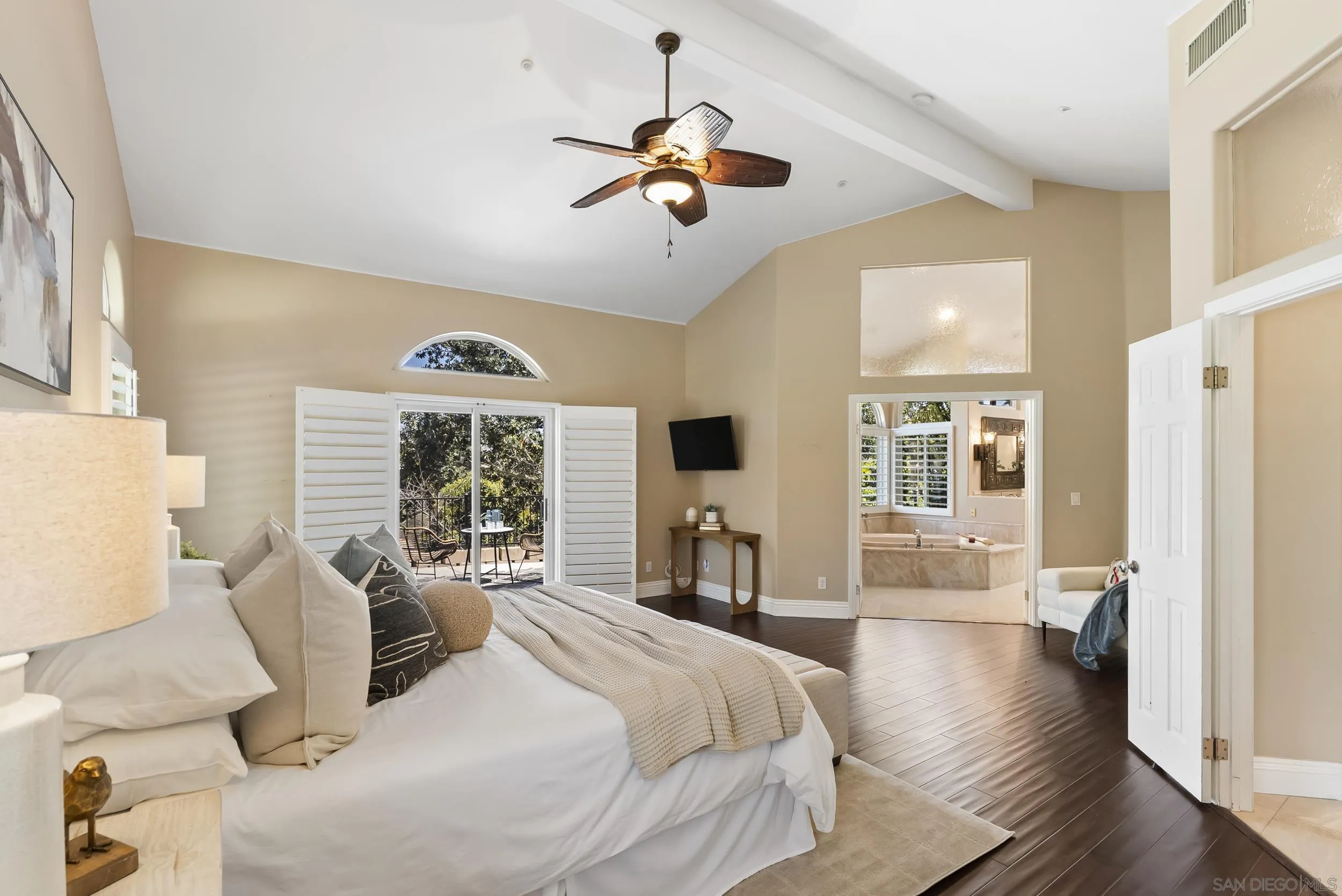 14998 Budwin Lane Poway, CA 92064 - Photo 25 of 44 a spacious bedroom with a large bed and a large window