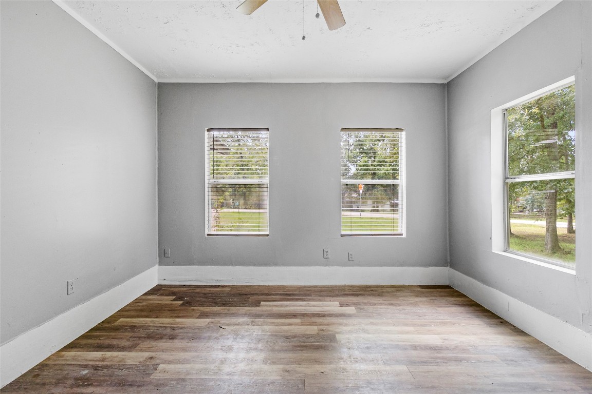 8 Jackson Road Huntsville, TX 77320 - Photo 13 of 26 a view of empty room with wooden floor and fan