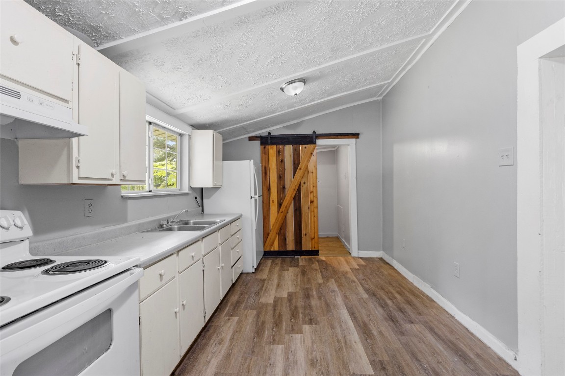 8 Jackson Road Huntsville, TX 77320 - Photo 6 of 26 a kitchen with a sink a window and appliances