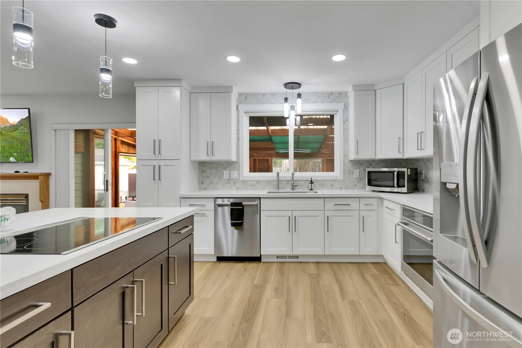 28012 236th Avenue Southeast Maple Valley, WA 98038 - Photo 14 of 39 a kitchen with stainless steel appliances granite countertop a refrigerator sink and stove