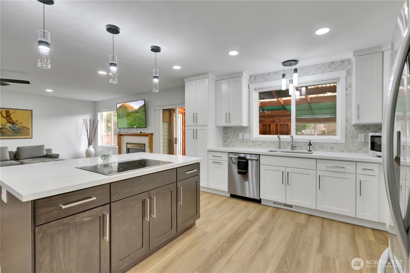 28012 236th Avenue Southeast Maple Valley, WA 98038 - Photo 16 of 39 a kitchen with a sink stove and cabinets