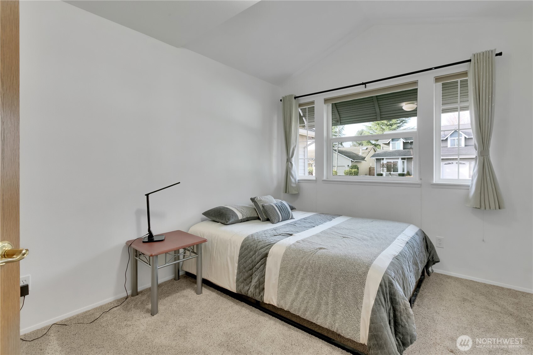 28012 236th Avenue Southeast Maple Valley, WA 98038 - Photo 25 of 39 a bedroom with a bed and a window