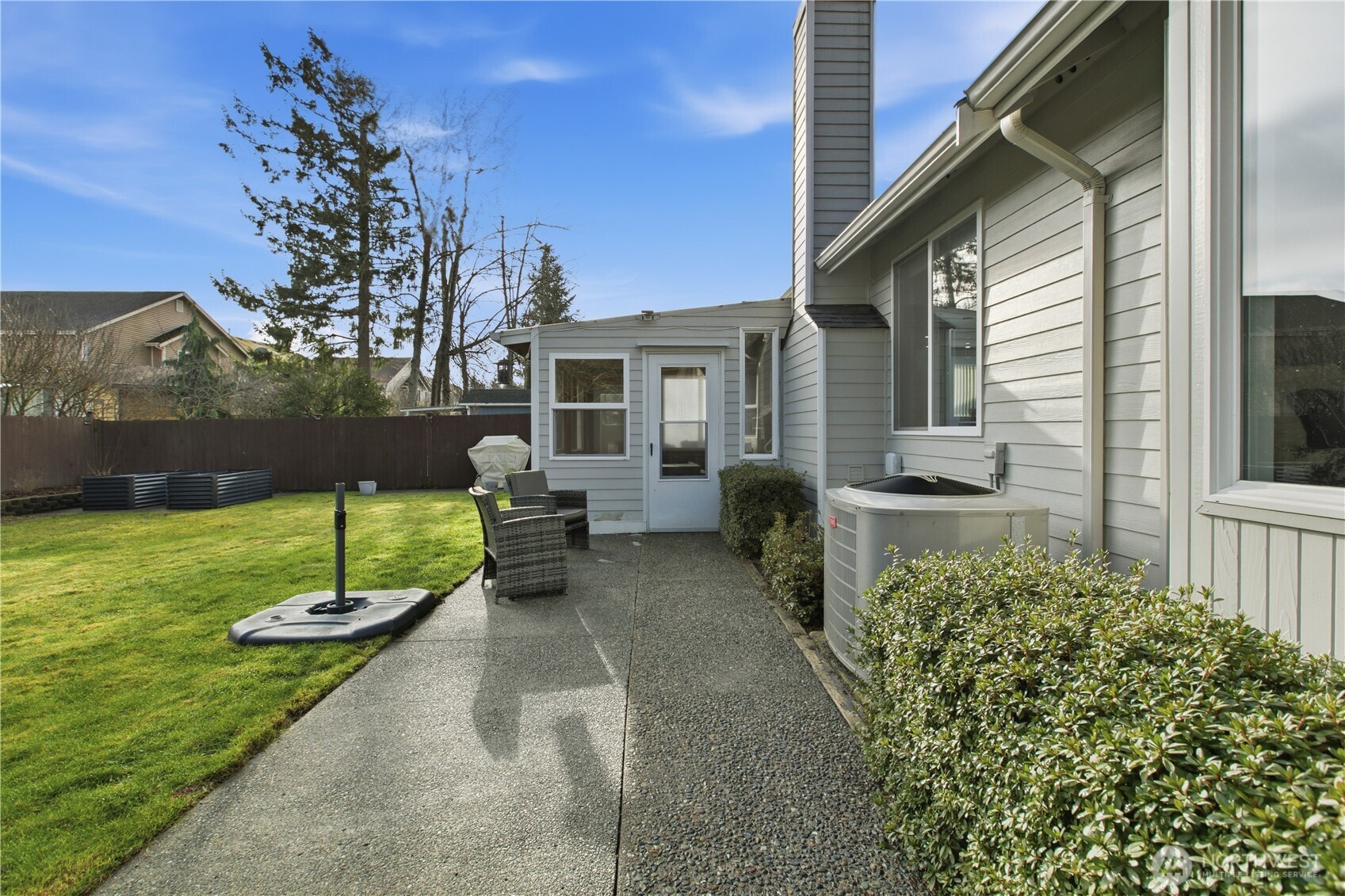 28012 236th Avenue Southeast Maple Valley, WA 98038 - Photo 29 of 39 a view of a house with backyard and a garden