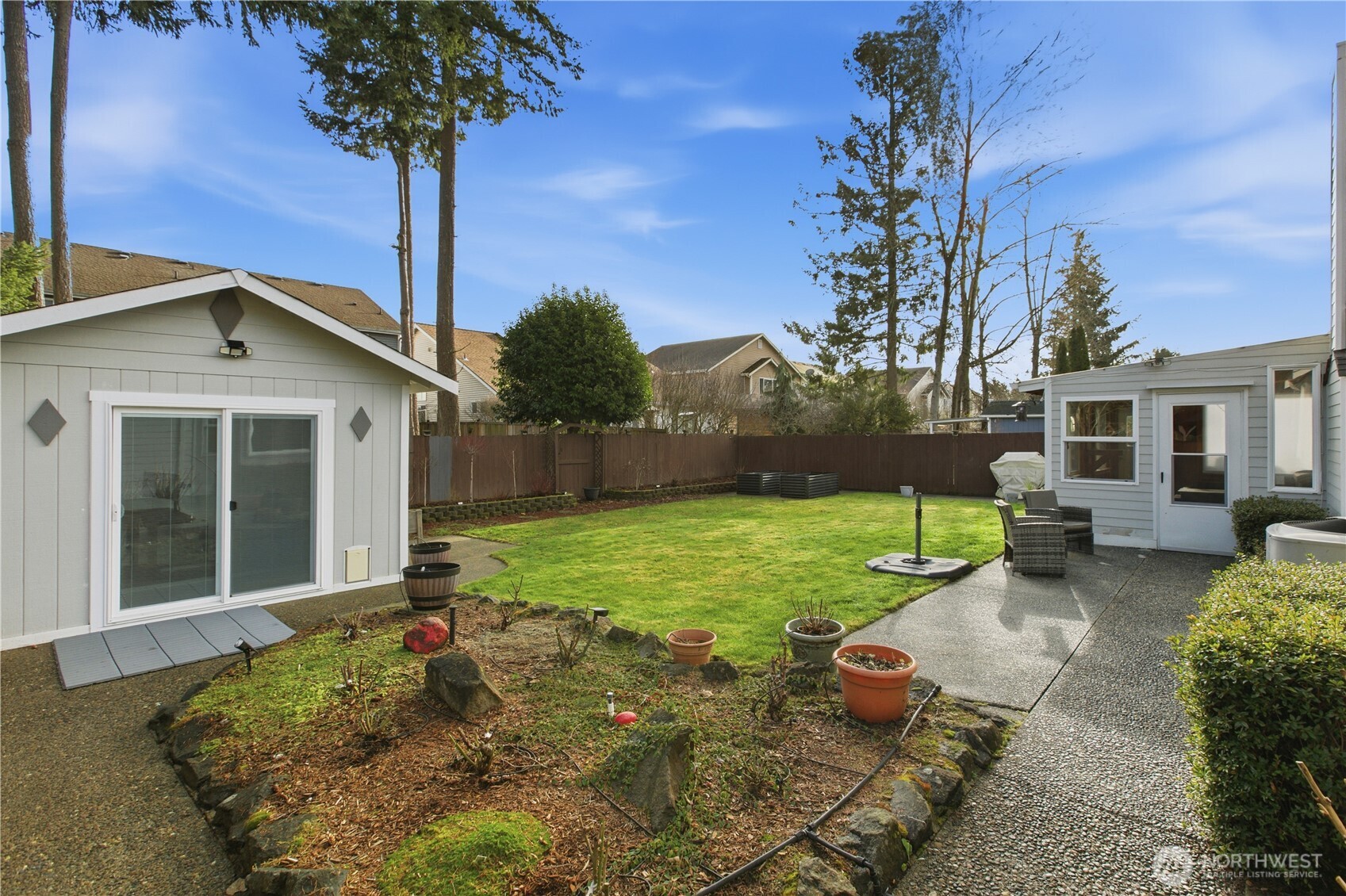28012 236th Avenue Southeast Maple Valley, WA 98038 - Photo 30 of 39 a front view of a house with garden