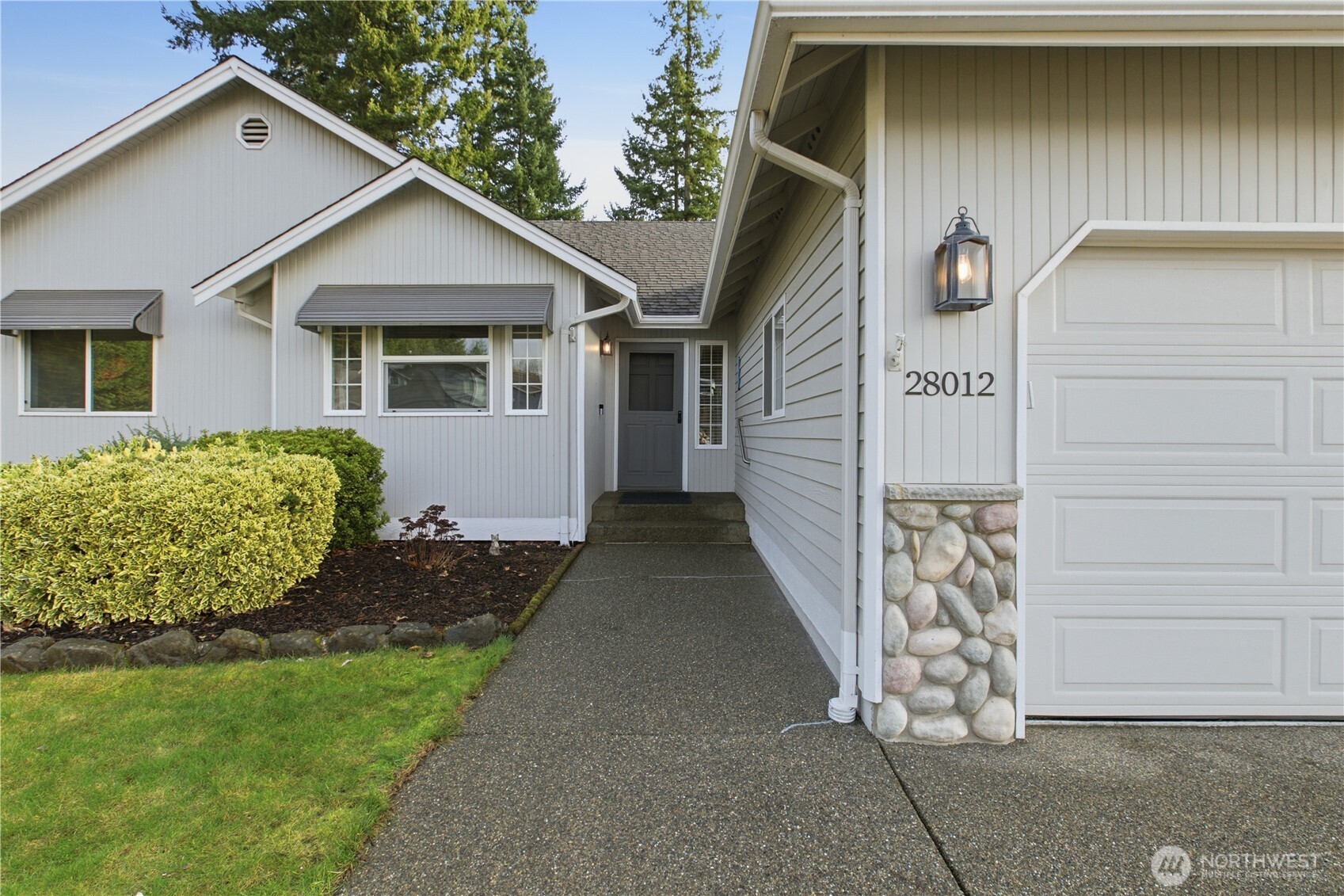 28012 236th Avenue Southeast Maple Valley, WA 98038 - Photo 3 of 39 a front view of a house with garden
