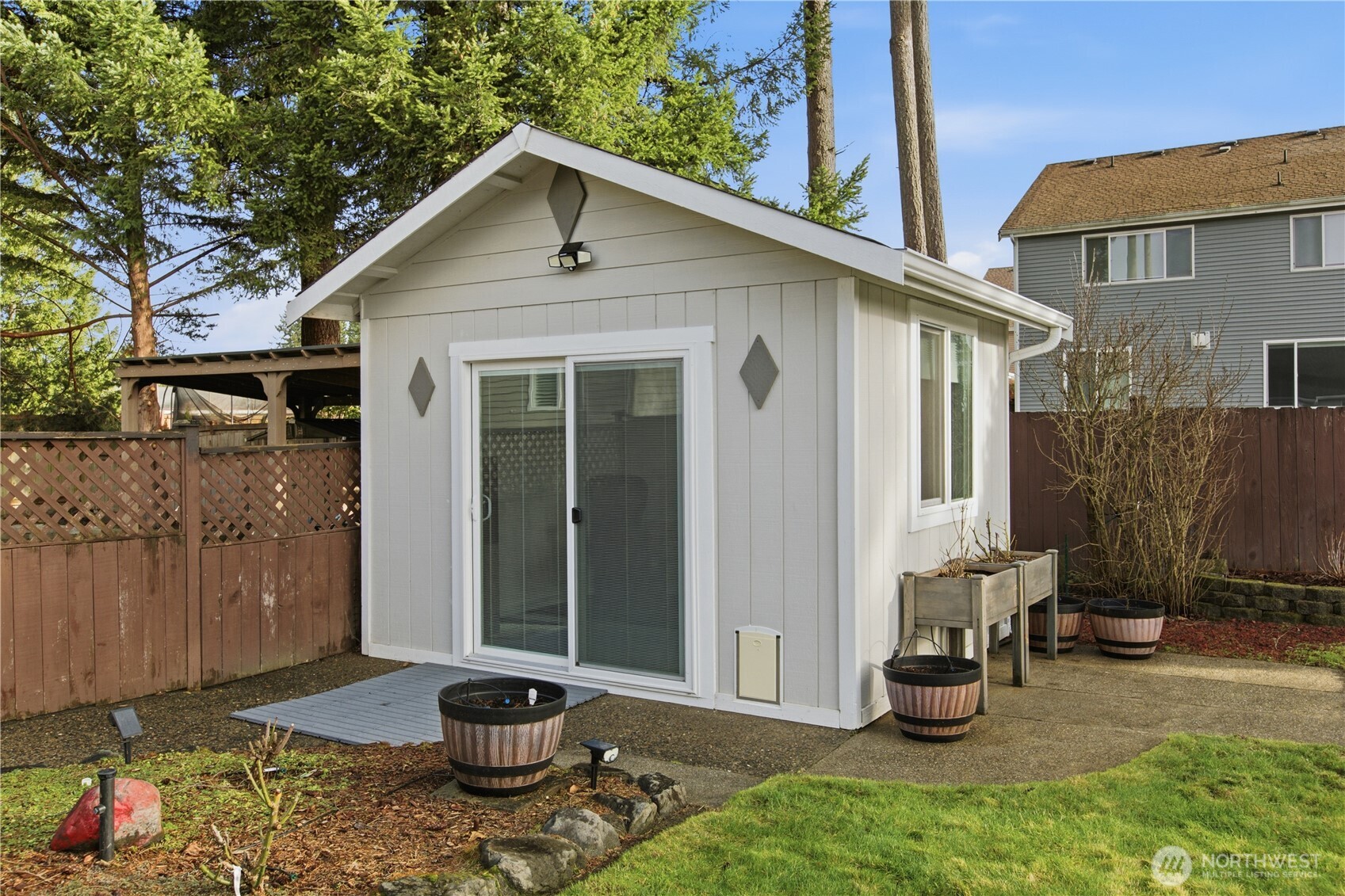 28012 236th Avenue Southeast Maple Valley, WA 98038 - Photo 31 of 39 a view of a back yard of the house with green space